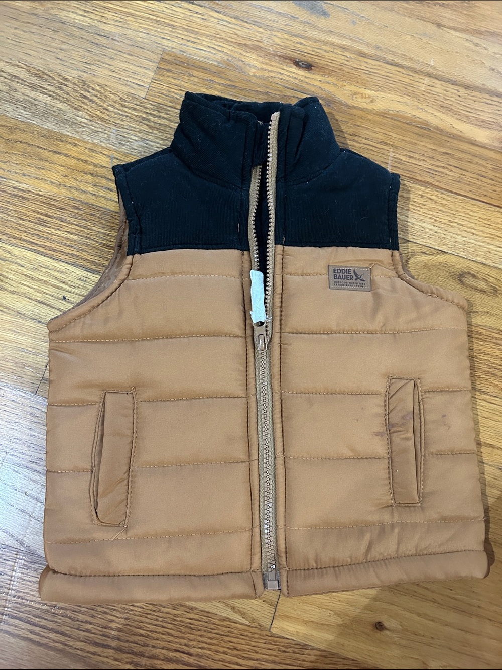 Eddie Bauer Kids Tan Puffer Vest with Black Collar (stain on pocket pictured)